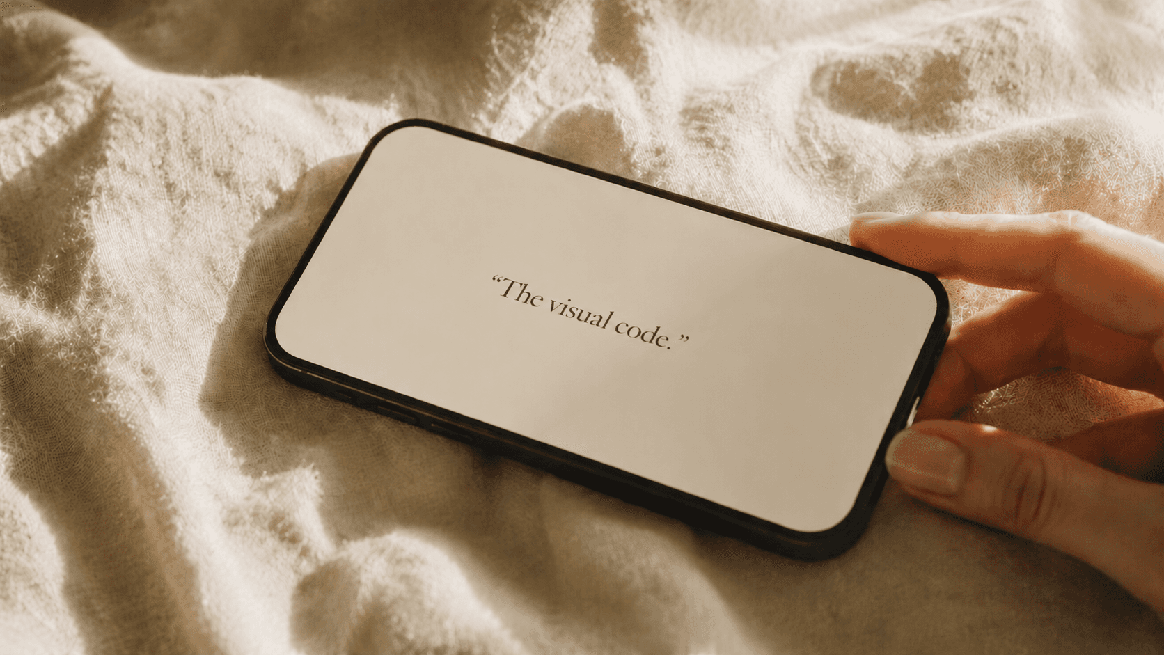 Editorial phone mockup showing the quote 'Soft & unembarrassed.' on cream linen.
